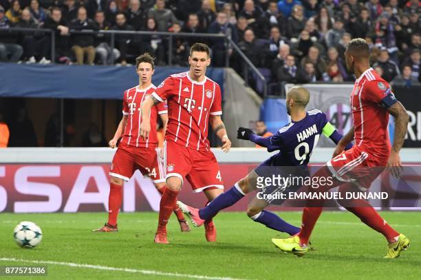 Anderlecht's Algerian midfielder Sofiane Hanni kicks to score a goal during the UEFA Champions League Group B football match between Anderlecht and...
