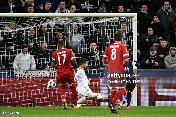 Anderlecht's Algerian midfielder Sofiane Hanni scores a goal past Bayern Munich's German goalkeeper Sven Ulreich during the UEFA Champions League...