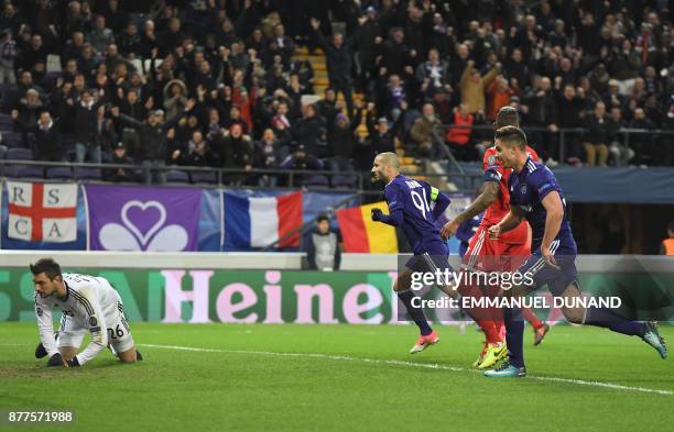 Anderlecht's Algerian midfielder Sofiane Hanni reacts after scoring a goal past Bayern Munich's German goalkeeper Sven Ulreich during the UEFA...