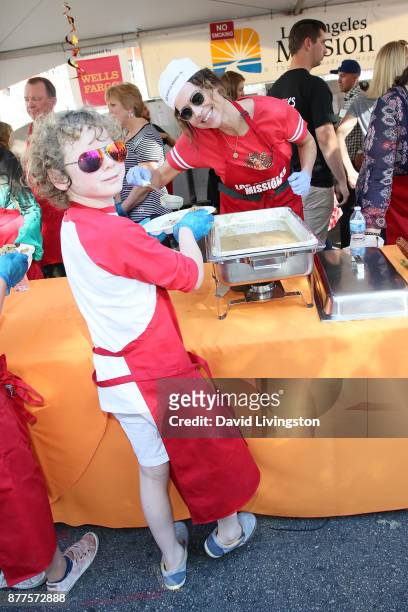 Minnie Driver and Henry Story Driver are seen at the Los Angeles Mission Thanksgiving Meal for the homeless at the Los Angeles Mission on November...