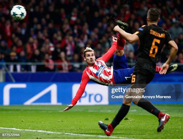 Antoine Griezmann of Atletico Madrid volleys to score his team's opening goal during the UEFA Champions League group C match between Atletico Madrid...