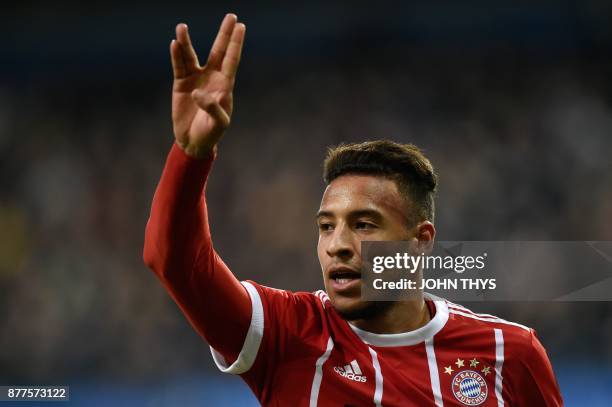 Bayern Munich's French midfielder Corentin Tolisso celebrates after scoring a goal during the UEFA Champions League Group B football match between...