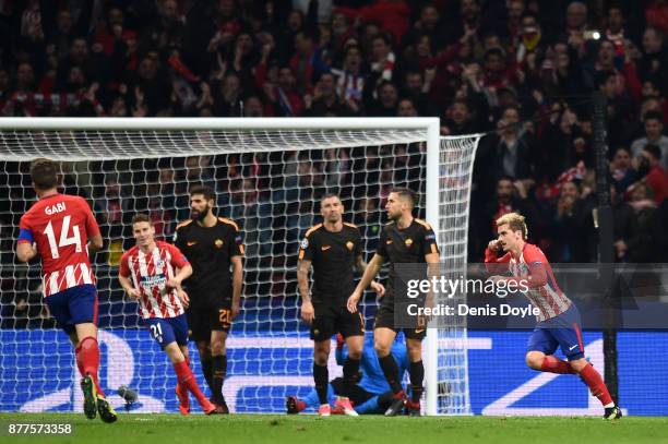 Antoine Griezmann of Atletico Madrid celebrates after scoring his team's opening goal during the UEFA Champions League group C match between Atletico...