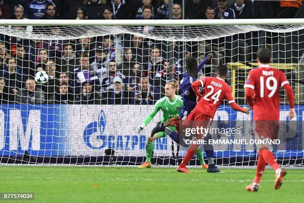 Bayern Munich's French midfielder Corentin Tolisso scores a goal past Anderlecht's Belgian goalkeeper Matz Sels during the UEFA Champions League...