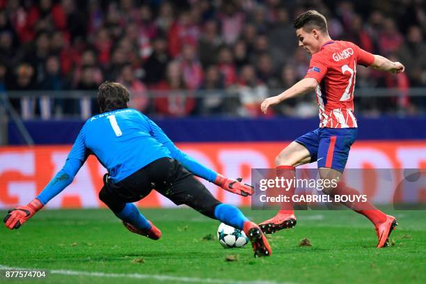 Atletico Madrid's French forward Kevin Gameiro prepares to score past Roma's Brazilian goalkeeper Alisson during the UEFA Champions League group C...