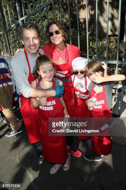John Ross Bowie, Minnie Driver, Nola Bowie, Henry Driver, and Walter Bowie are seen at the Los Angeles Mission Thanksgiving Meal for the homeless at...