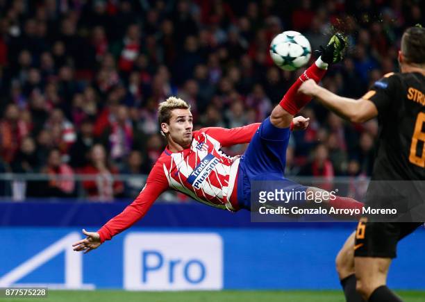 Antoine Griezmann of Atletico Madrid volleys to score his team's opening goal during the UEFA Champions League group C match between Atletico Madrid...