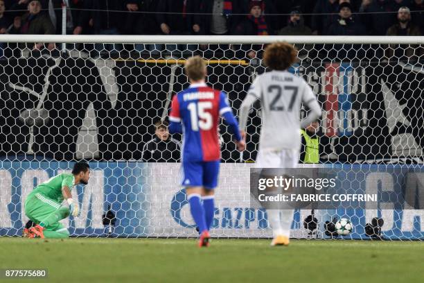 Manchester United's Argentinian goalkeeper Sergio Romero watches the ball entering his goal during the UEFA Champions League Group A football match...