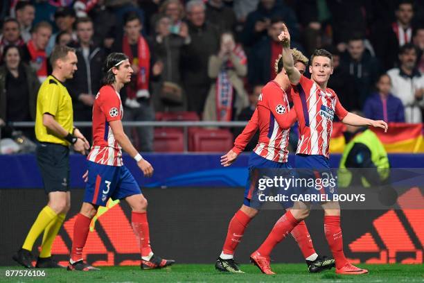 Atletico Madrid's French forward Kevin Gameiro celebrates with Atletico Madrid's French forward Antoine Griezmann and Atletico Madrid's Brazilian...