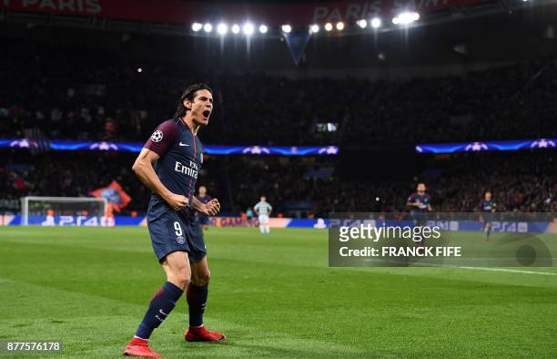 Paris Saint-Germain's Uruguayan striker Edinson Cavani celebrates after scoring during the UEFA Champions League Group B football match between Paris...