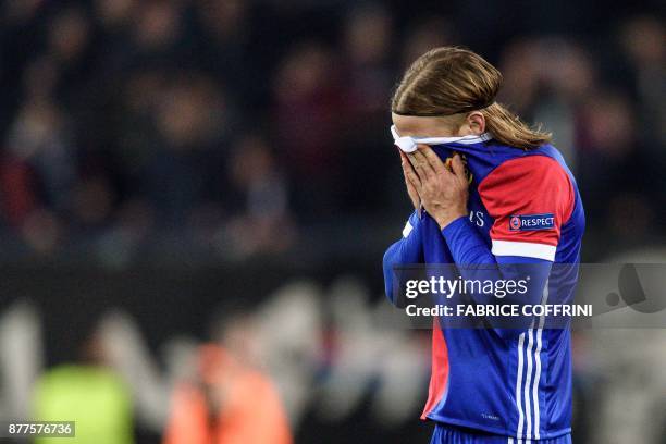 Basel's Swiss defender Michael Lang, who scored the only goal, reacts at the end of the UEFA Champions League Group A football match between FC Basel...