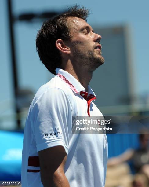 Frederik Nielsen of Denmark shows his disappointment against Kevin Anderson of South Africa during a Men's Singles 1st round match on day one of the...