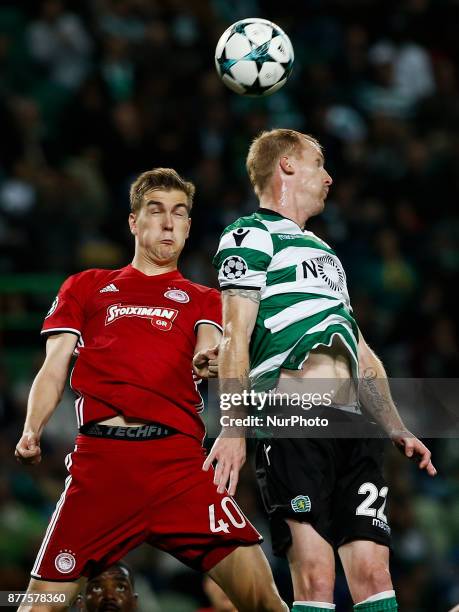 Olympiakos's defender Bjorn Engels vies for the ball with Sporting's defender Jeremy Mathieu during Champions League 2017/18 match between Sporting...