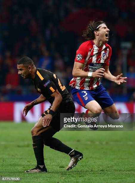 Bruno Peres of AS Roma fouls Filipe Luis of Atletico Madrid leading to his sending off during the UEFA Champions League group C match between...