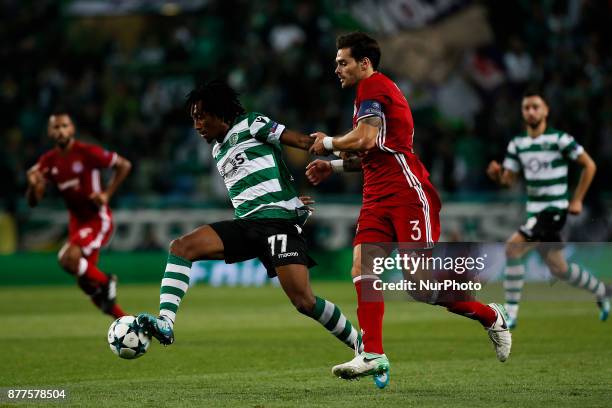 Sporting's forward Gelson Martins vies for the ball with Olympiakos's defender Alberto Botia during Champions League 2017/18 match between Sporting...