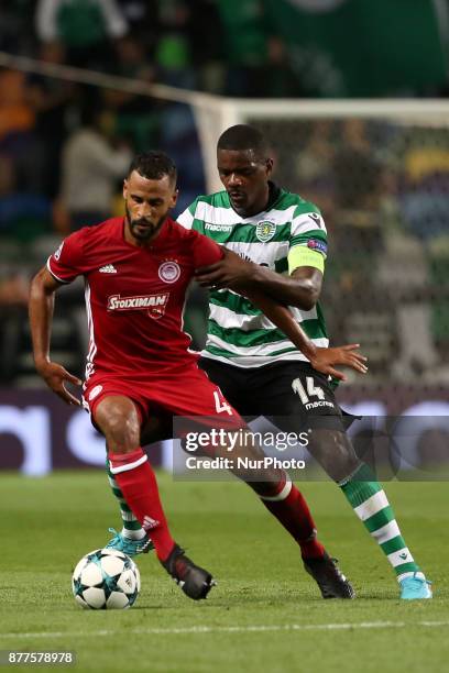 Olympiacos' midfielder Alaixys Romao vies with Sporting's midfielder William Carvalho from Portugal during the UEFA Champions League group D football...