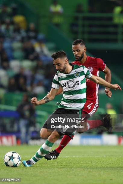 Sporting's midfielder Bruno Fernandes from Portugal vies with Olympiacos' midfielder Alaixys Romao during the UEFA Champions League group D football...