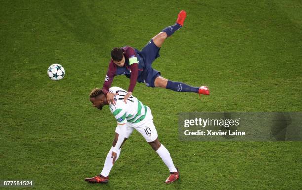 Captain Thiago Silva of Paris Saint-Germain jump over Moussa Dembele of Celtics Glasgow during the UEFA Champions League group B match between Paris...