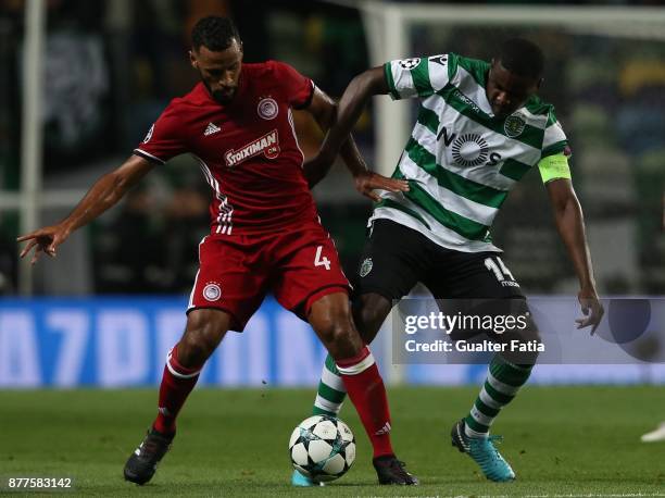 Olympiakos Piraeus midfielder Alaixys Romao from Tongo with Sporting CP midfielder William Carvalho from Portugal in action during the UEFA Champions...