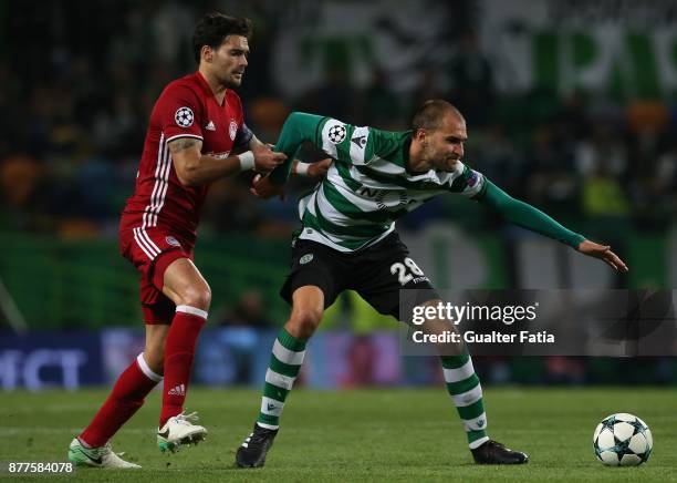 Sporting CP forward Bas Dost from Holland with Olympiakos Piraeus defender Alberto Botia from Spain in action during the UEFA Champions League match...