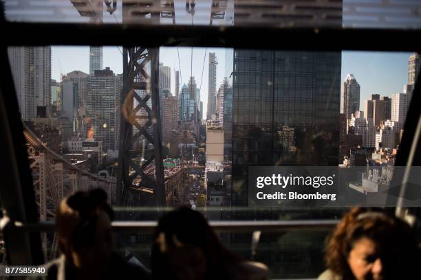 Commuters ride the Roosevelt Island Tramway in New York, U.S., on Tuesday, Oct. 17, 2017. Cornell Techion, a new technology-oriented graduate school,...