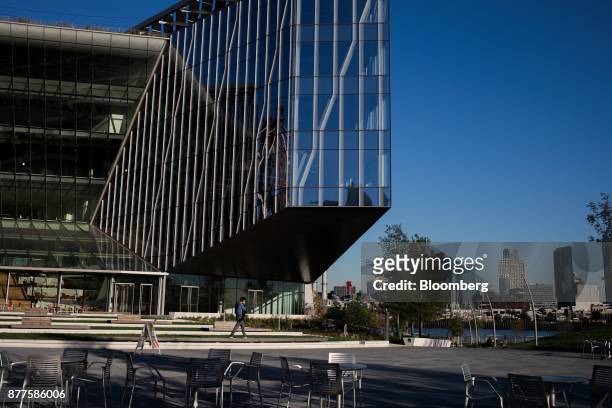 Pedestrian walks past a building at the Cornell Technion campus on Roosevelt Island in New York, U.S., on Tuesday, Oct. 17, 2017. Cornell Techion, a...