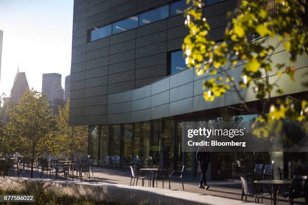 Man walks past a building at the Cornell Technion campus on Roosevelt Island in New York, U.S., on Tuesday, Oct. 17, 2017. Cornell Techion, a new...