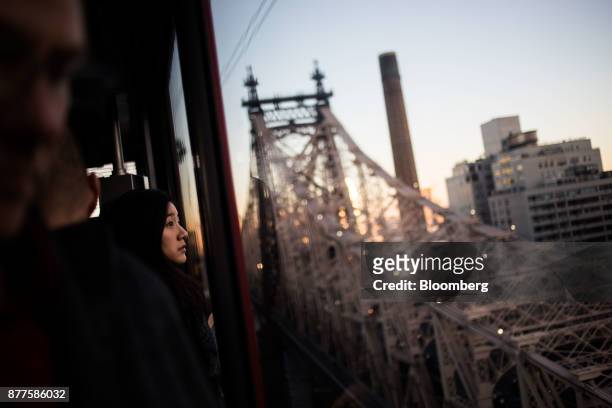 Commuters ride the Roosevelt Island Tramway in New York, U.S., on Tuesday, Oct. 17, 2017. Cornell Techion, a new technology-oriented graduate school,...