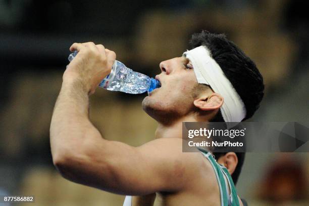 Kazakhstans Abylaikhan Amzeyev competes with Irans Amin Yavar Kaviyaninejad during the Senior U23 Wrestling World Championships in the 66 kg class on...