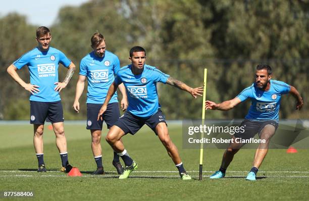 Tim Cahill and Manny Muscat of the City perform a training drill during a Melbourne City A-League training session at City Football Academy on...