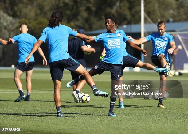 Osama Malik and Bruce Kamau of the City stretch during a Melbourne City A-League training session at City Football Academy on November 23, 2017 in...