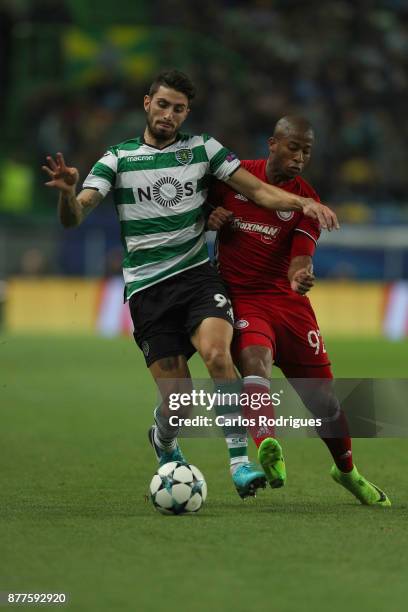 Sporting CP defender Cristiano Piccini from Italy vies with Olympiakos Piraeus midfielder Seba from Brazil for the ball possession during the UEFA...