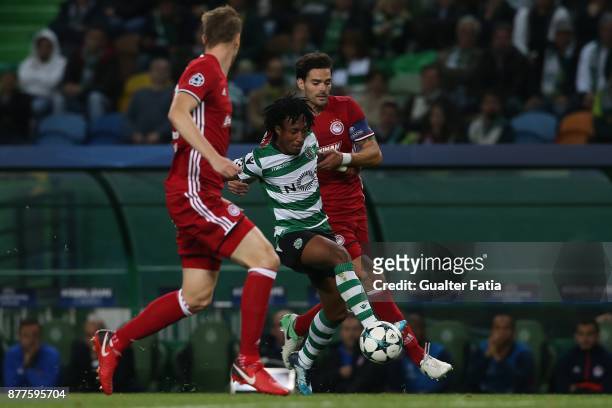 Sporting CP forward Gelson Martins from Portugal with Olympiakos Piraeus defender Alberto Botia from Spain in action during the UEFA Champions League...