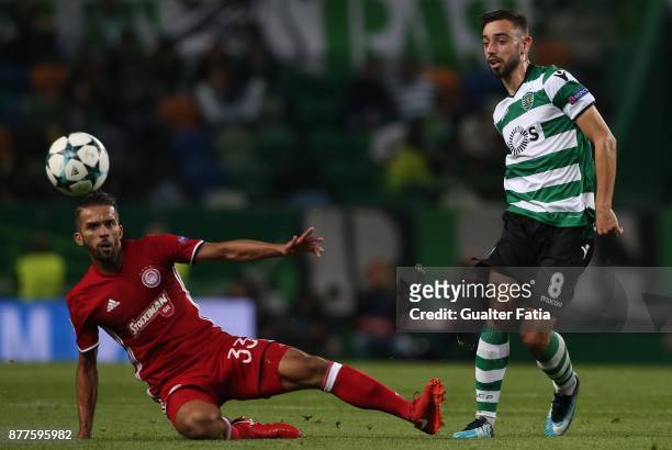 Sporting CP midfielder Bruno Fernandes from Portugal with Olympiakos Piraeus midfielder Mehdi Carcela Gonzalez from Marrocos in action during the...
