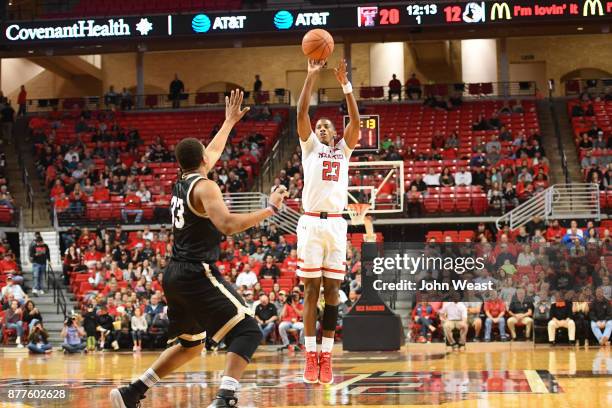 Jarrett Culver of the Texas Tech Red Raiders shoots the ball over Cameron Jackson of the Wofford Terriers during the first half of the game between...