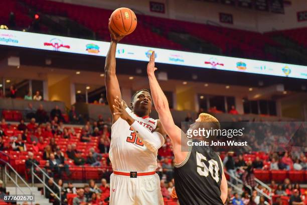 Norense Odiase of the Texas Tech Red Raiders shoots the ball over Matthew Pegram of the Wofford Terriers during the first half of the game on...
