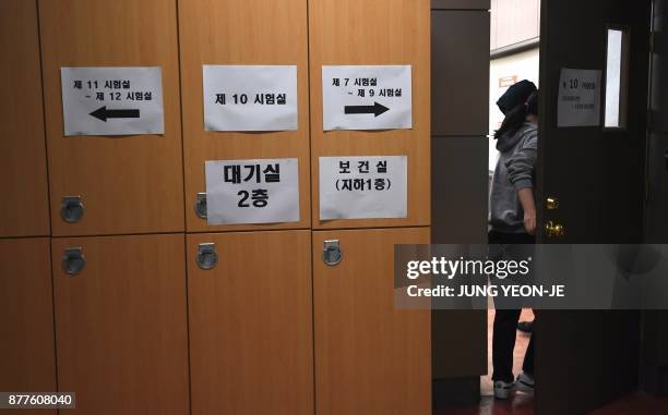 Student enters an exam room to take the annual College Scholastic Ability Test, a standardised exam for college entrance, at a high school in Seoul...