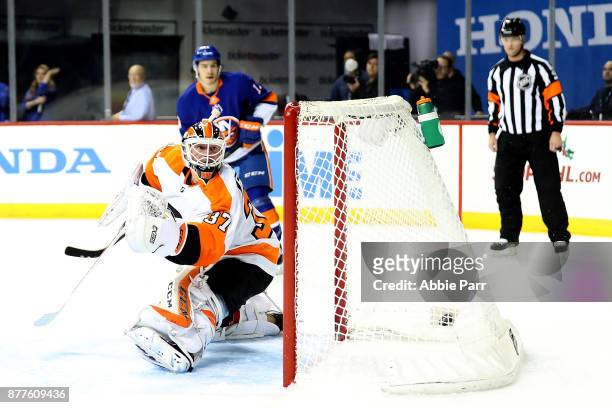 Brian Elliott of the Philadelphia Flyers gives up a goal to Johnny Boychuk of the New York Islanders in the second period during their game at...