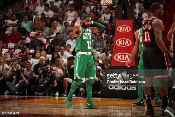 Kyrie Irving of the Boston Celtics puts on mask during game against the Miami Heat on November 22, 2017 at AmericanAirlines Arena in Miami, Florida....
