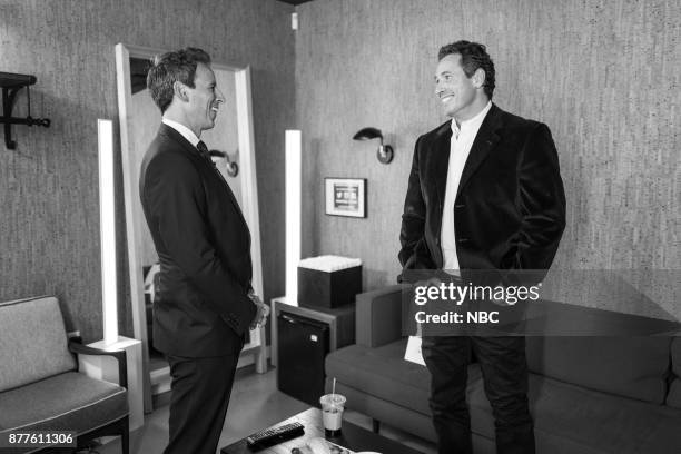 Episode 613 -- Pictured: Host Seth Meyers talks with journalist Chris Cuomo backstage on November 22, 2017 --