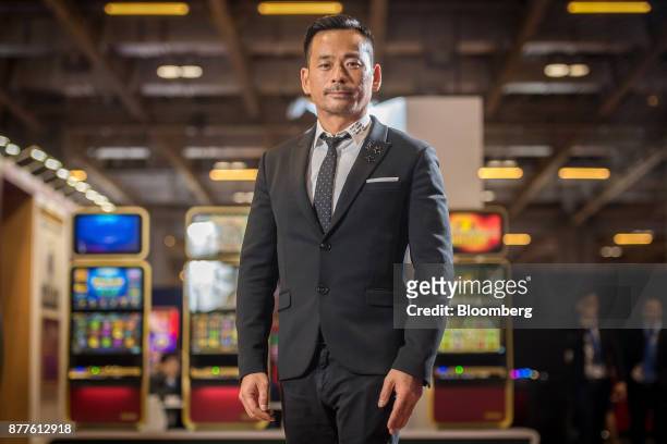 Alvin Chau, founder and chairman of Suncity Group Holdings Ltd., stands for a photograph after an interview during the Macau Gaming Show at the...