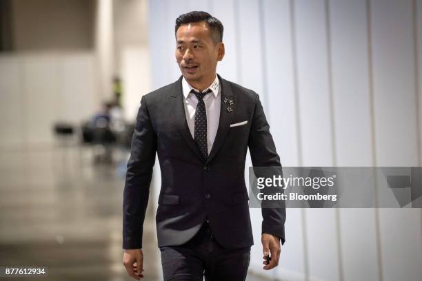 Alvin Chau, founder and chairman of Suncity Group Holdings Ltd., walks the floor during the Macau Gaming Show at the Venetian Hotel in Macau, China,...