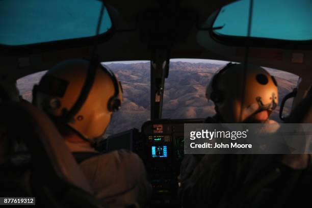 Customs and Border Protection , pilots fly over the Big Bend area of west Texas on November 22, 2017 near Van Horn, Texas. Federal agents are...