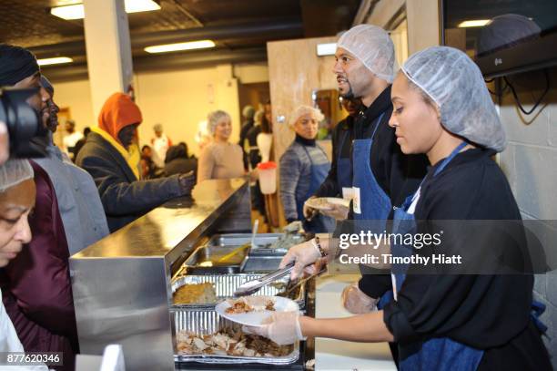 Common and Tai Davis volunteer at St Stephen AME Church in partnership with Feeding America, The Common Ground Foundation and Greater Chicago Food...