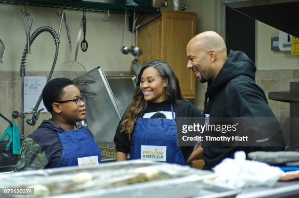 Shamon Brown Jr., Tai Davis, and Common volunteer at St Stephen AME Church in partnership with Feeding America, The Common Ground Foundation and...