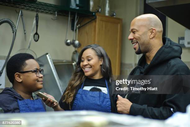 Shamon Brown Jr., Tai Davis, and Common volunteer at St Stephen AME Church in partnership with Feeding America, The Common Ground Foundation and...