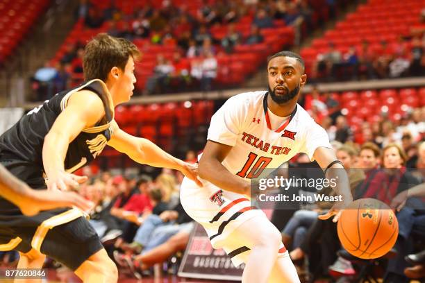 Niem Stevenson of the Texas Tech Red Raiders passes the ball during the game against the Wofford Terriers on November 22, 2017 at United Supermarkets...