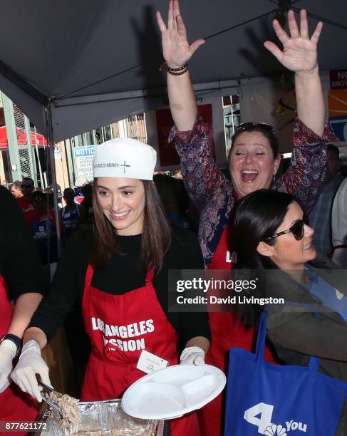 Actresses Emmy Rossum and Camryn Manheim attend the Los Angeles Mission Thanksgiving Meal for the homeless at the Los Angeles Mission on November 22,...