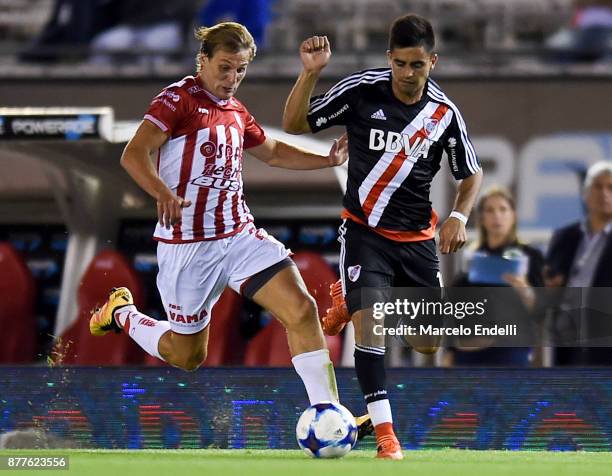 Gonzalo Martinez of River Plate fights for ball with Manuel De Iriondo of Union during a match between River and Union as part of Superliga 2017/18...