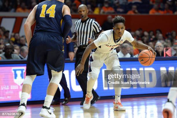 Illinois Fighting Illini guard Trent Frazier controls the ball outside of the three point line during the college basketball game between the...